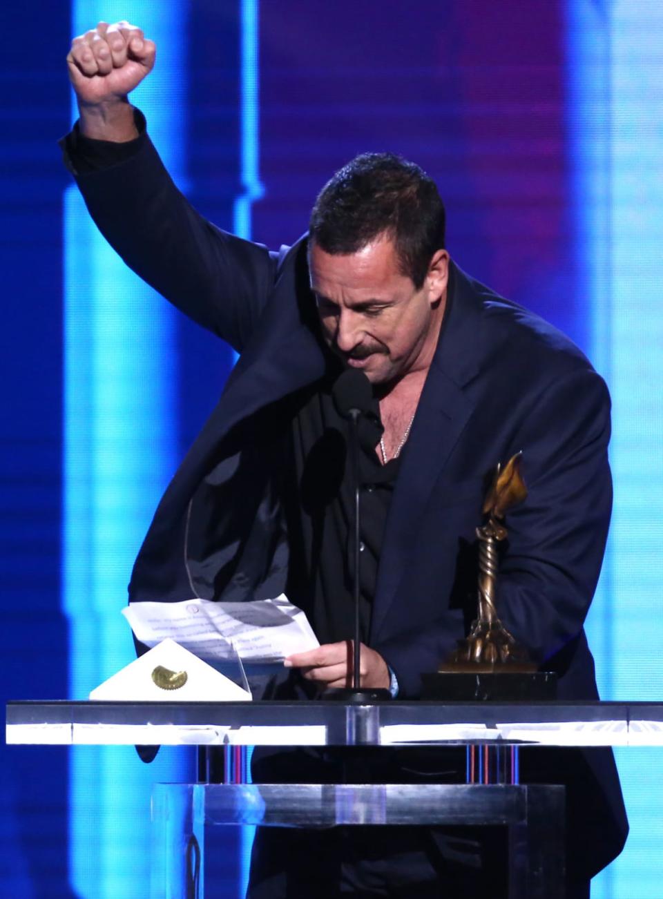 <div class="inline-image__caption"><p>Sandler accepts the Best Male Lead award for <em>Uncut Gems</em> onstage during the 2020 Film Independent Spirit Awards. </p></div> <div class="inline-image__credit">Tommaso Boddi/Getty</div>