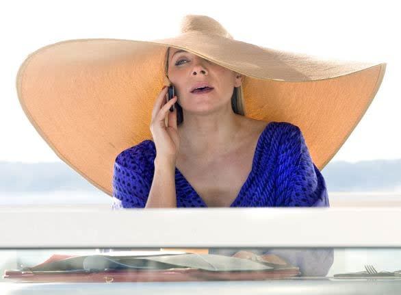 Samantha (Kim Cattrall), ever wary of the sun's harmful effects, sports an oversize straw hat. More... • Hot couture on 'Sex and the City' film Also in Image • Fashion rules thrown out at Cannes Film Festival • Makeup in electric, neon colors • Margherita Missoni builds her own bohemian look • Back to Image