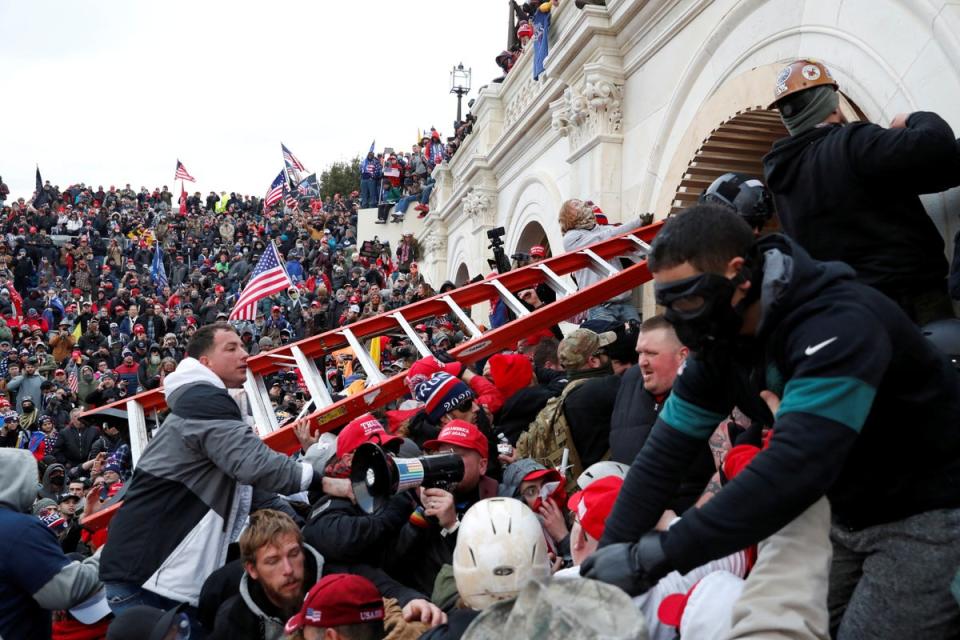 A mob of Donald Trump’s supporters broke through barricades and into the US Capitol on January 6, 2021. (REUTERS)