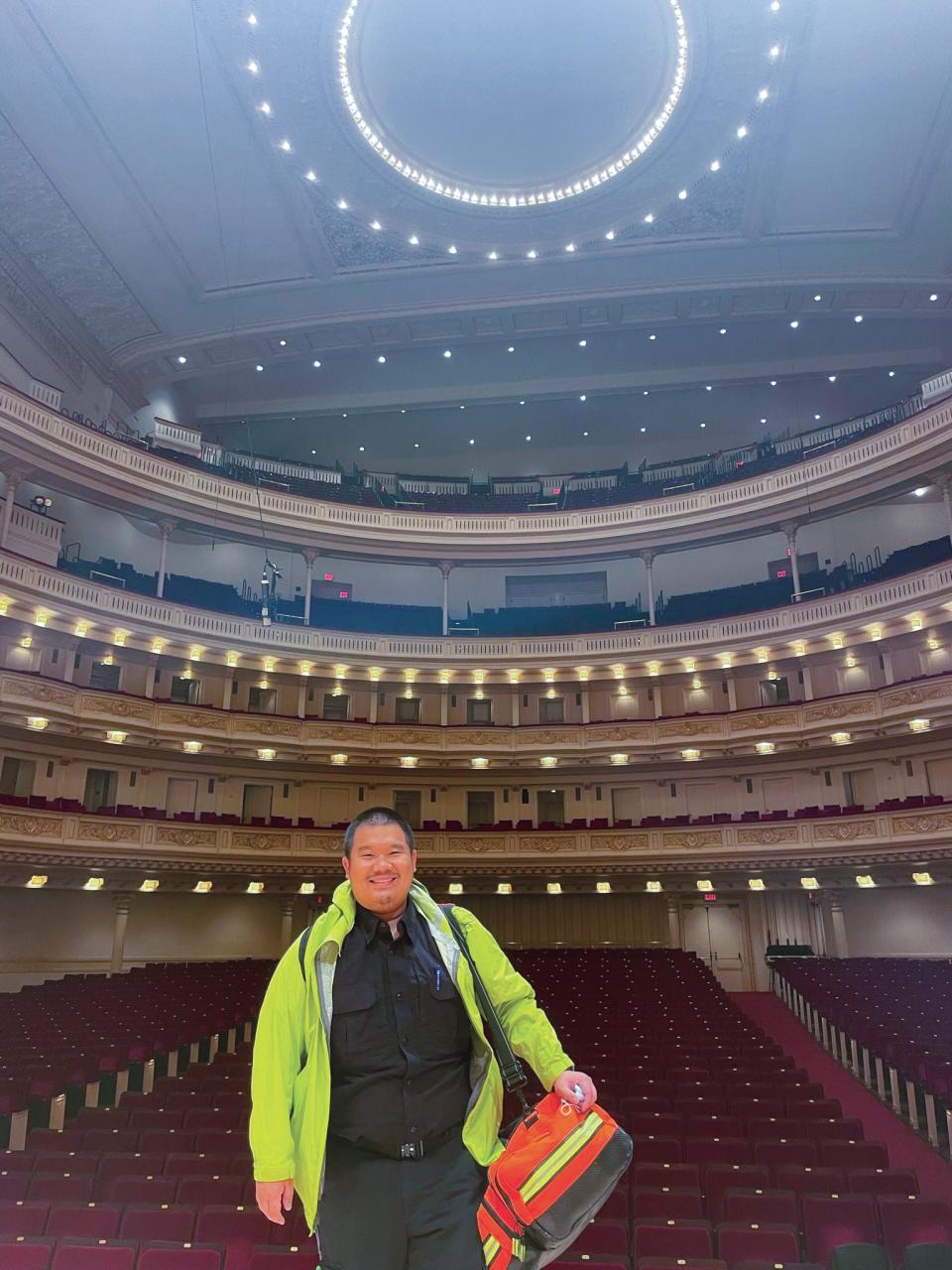 Justin Tsai stands on the stage of the famed performance space where he provided standby medical services for the ViacomCBS, Paramount+, Pluto TV, and MTV Networks 2022 Upfront event.