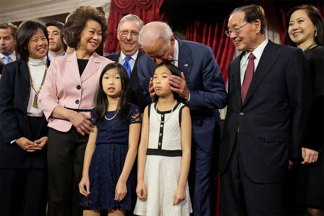 <p>Jacquelyn Martin/AP</p> The Chao family accompanies Mitch McConnell as he's sworn-in as Senate majority leader by then-Vice President Joe Biden on Jan. 6, 2015