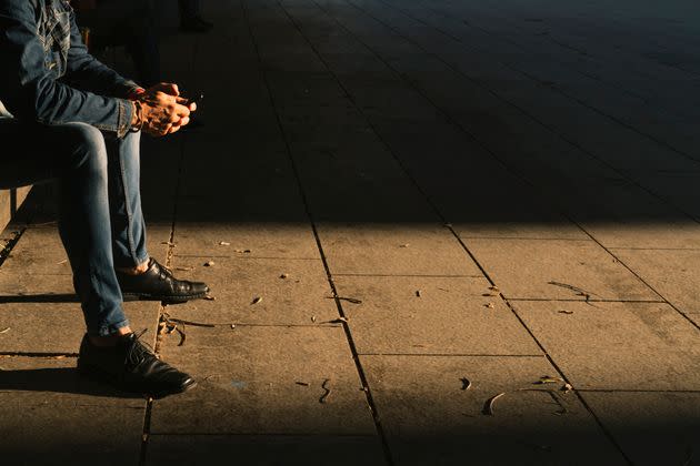 Barcelona spain Nov 04 2019 :tourist people sit relax on public bench in light shade sunlight (Photo: travelism via Getty Images)