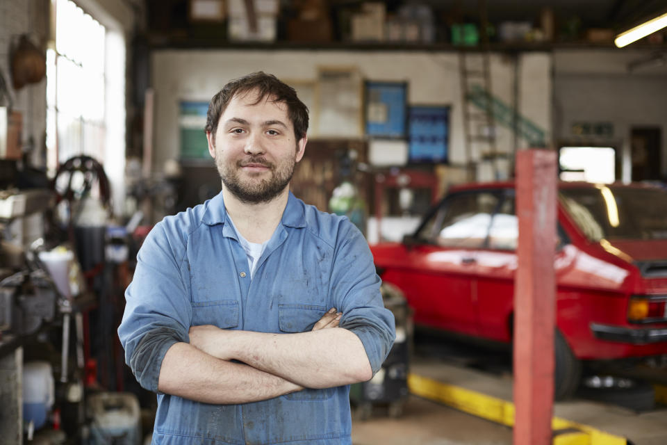 Portrait of junior car mechanic