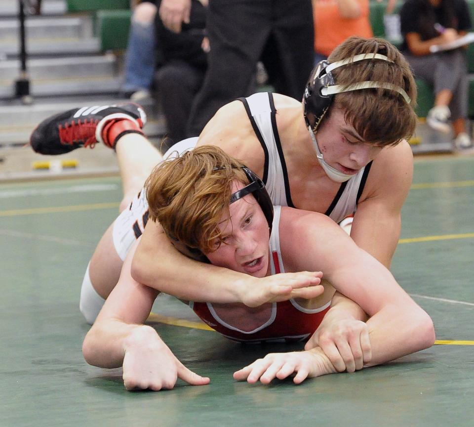 Dalton's Greyson Siders pins Wadsworth's Adam Ryder in the 157-pound final.