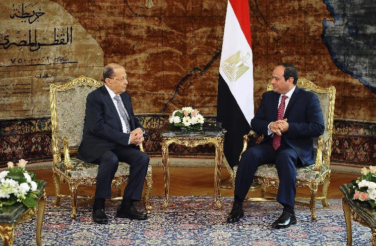 In this Monday, Feb. 13, 2017, handout photo provided by the Egyptian presidency, Lebanese President Michel Aoun, talks with his Egyptian counterpart, Abdel-Fattah el-Sissi in Cairo. Lebanon's newly elected president is visiting Egypt for the first time since his inauguration and a day after defending the Shiite militant group Hezbollah in remarks to a private Egyptian TV station. (Photo courtesy: Egyptian presidency via AP)