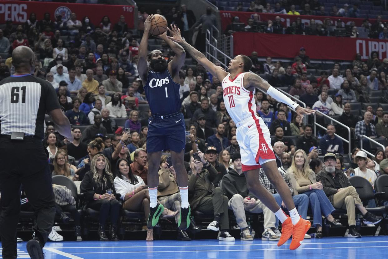 Los Angeles Clippers guard James Harden, left, shoots as Houston Rockets forward Jabari Smith Jr. defends during the first half of an NBA basketball In-Season Tournament game Friday, Nov. 17, 2023, in Los Angeles. (AP Photo/Mark J. Terrill)