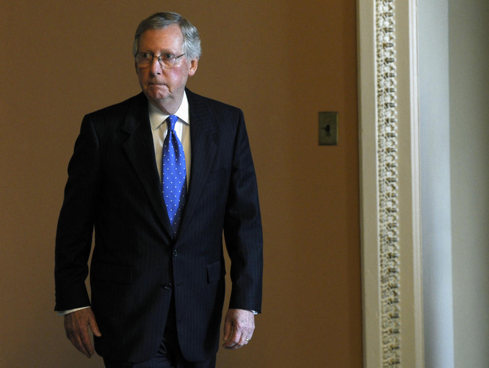 Senate Minority Leader Mitch McConnell of Kentucky heads to a closed-door meeting of Senate Republicans on Capitol Hill in Washington, Wednesday, Oct. 9, 2013. (AP Photo/Susan Walsh)