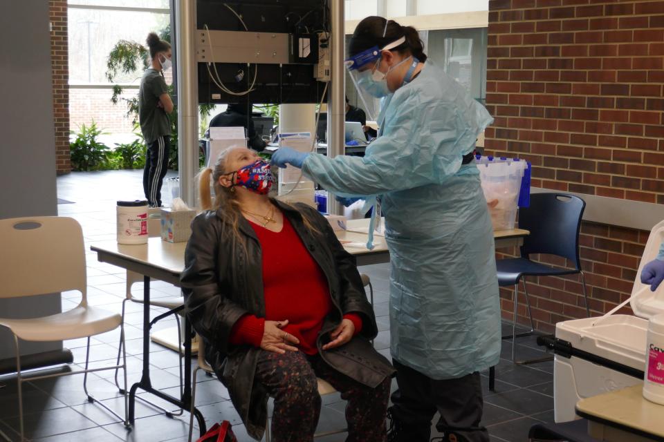 Patricia Messatzzia, of Bristol Township, gets her nose swabbed for testing for the coronavirus as part of the free COVID-19 testing now being offered at the Gene and Marlene Epstein Campus and the two other campuses of Bucks County Community College by AMI, a testing firm based in Reston, Va.