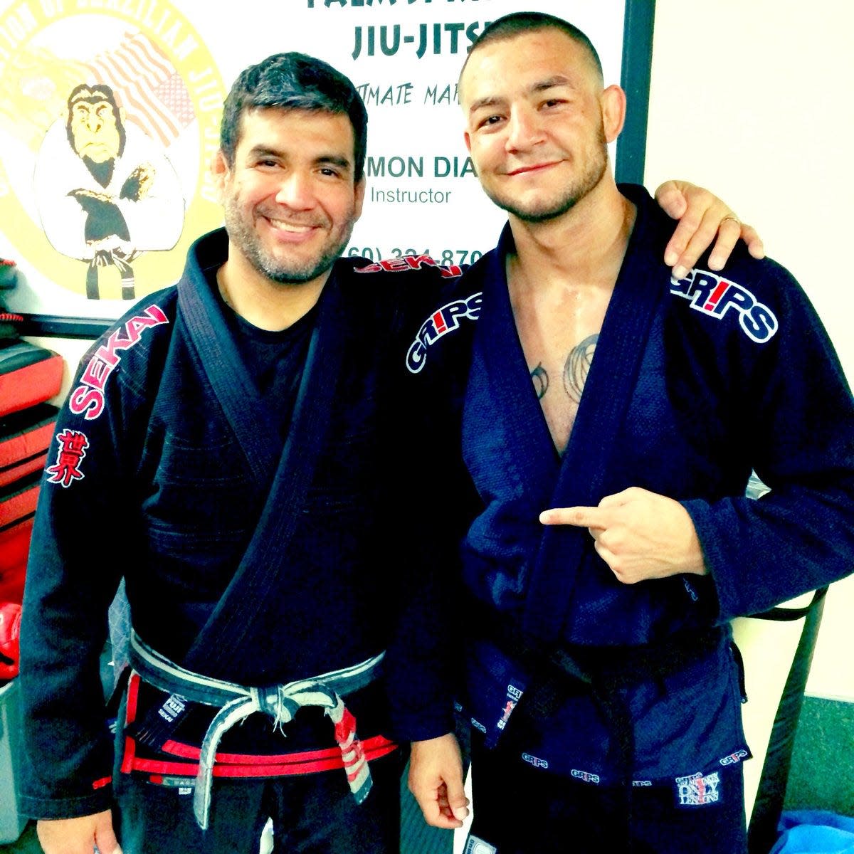 In this undated photo, Ramon Diaz, left, stands with UFC fighter Cub Swanson.
