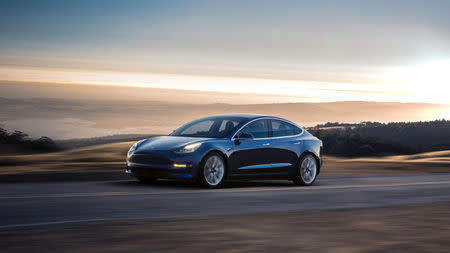 A Tesla Model 3 sedan is seen in this undated handout image as the car company handed over its first 30 Model 3 vehicles to employee buyers at the company’s Fremont facility in California, U.S. on July 28, 2017. Tesla/Handout via REUTERS