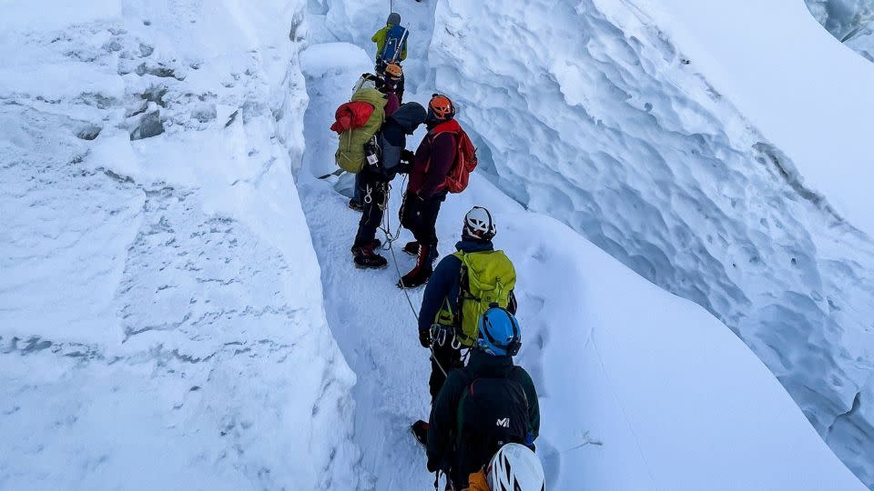 Mountaineers climbing during their ascend to summit Mount Everest on May 7, 2021. - Pemba Dorje Sherpa/AFP/Getty Images