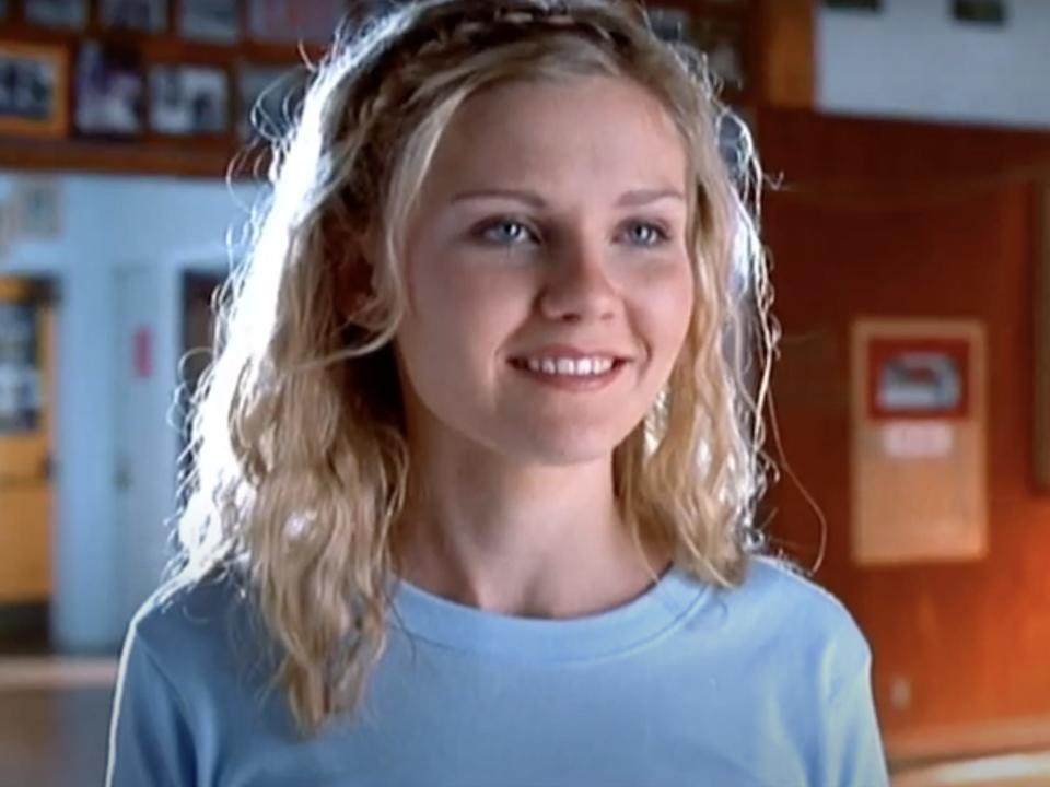 Kirsten Dunst wearing a blue shirt in Bring it On