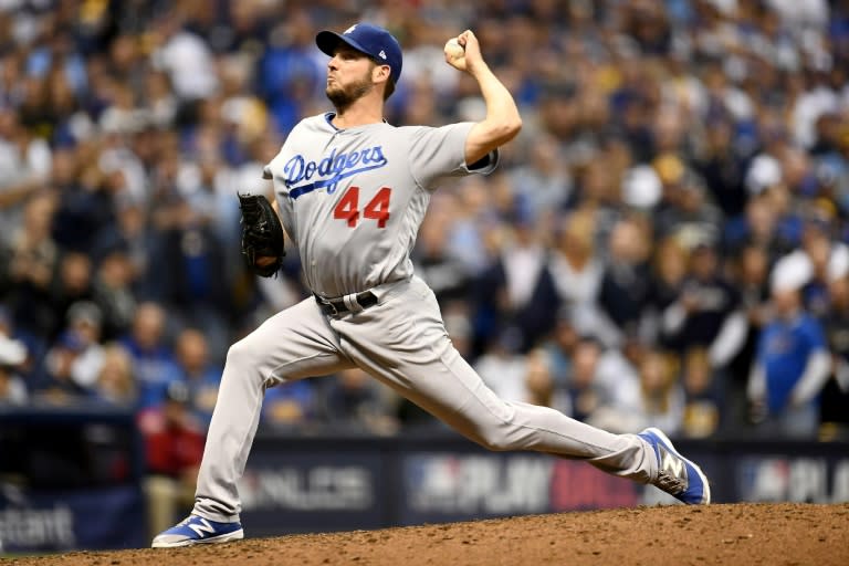 Rich Hill of the Los Angeles Dodgers throws a pitch against the Milwaukee Brewers during the eighth inning in Game Six of the National League Championship Series