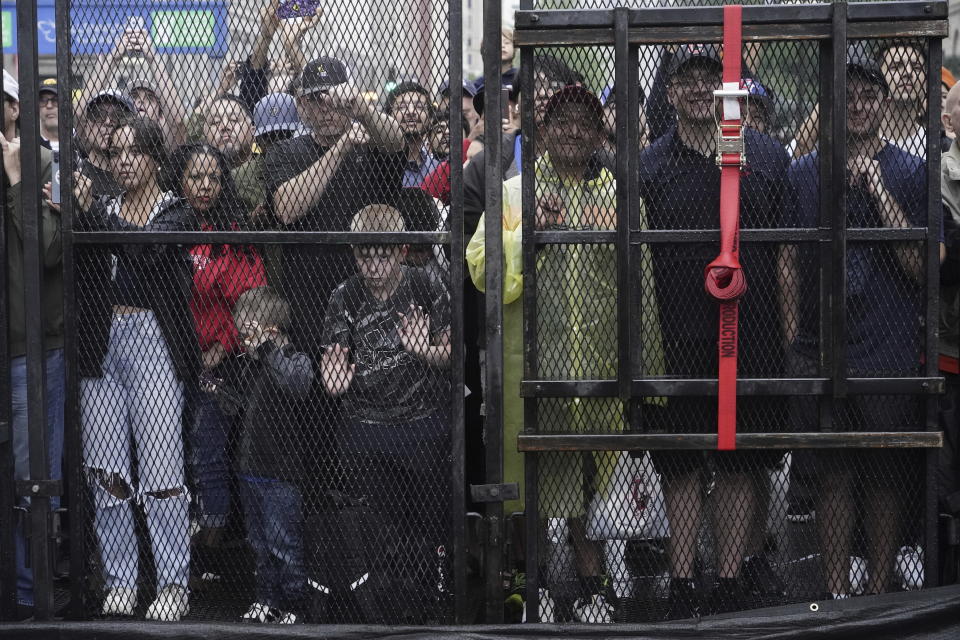 Fans watch as cars pass during a NASCAR Cup Series auto race at the Grant Park 220 Sunday, July 2, 2023, in Chicago. (AP Photo/Morry Gash)