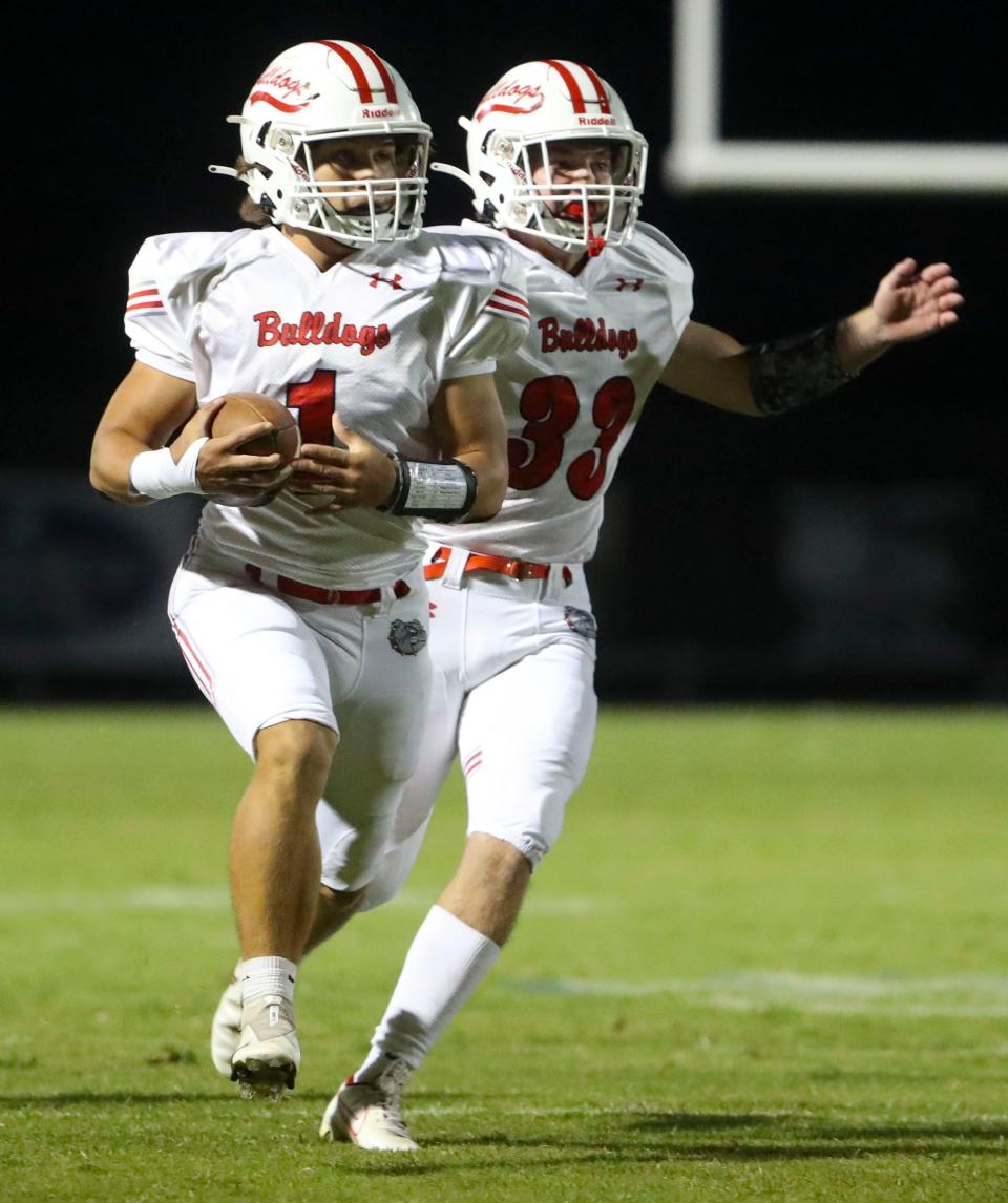 Laurel's Royce Scotton grabs a kickoff in front of teammate Evan Collins before Woodbridge can get to it in the first half of Laurel's 42-0 win at Woodbridge High School, Thursday, Oct. 6, 2022.