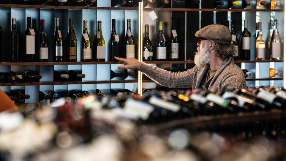 man shopping in wine store