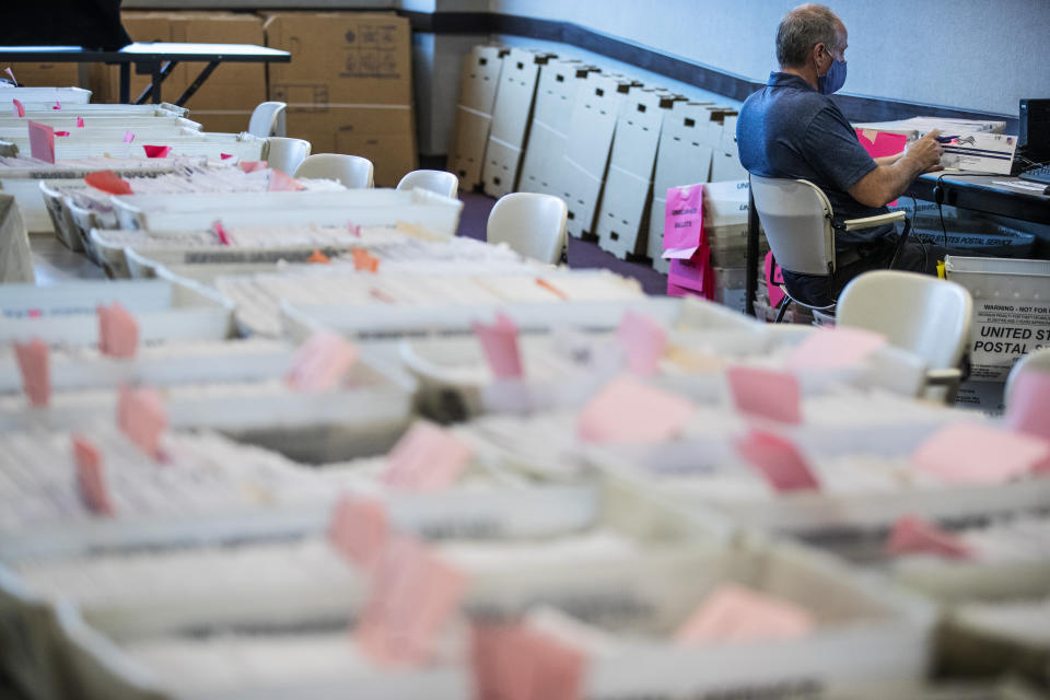 Dave Turnier processes mail-in ballots at at the Chester County Voter Services office in West Chester, Pa., prior to the primary election on May 28, 2020. (Matt Rourke/AP)