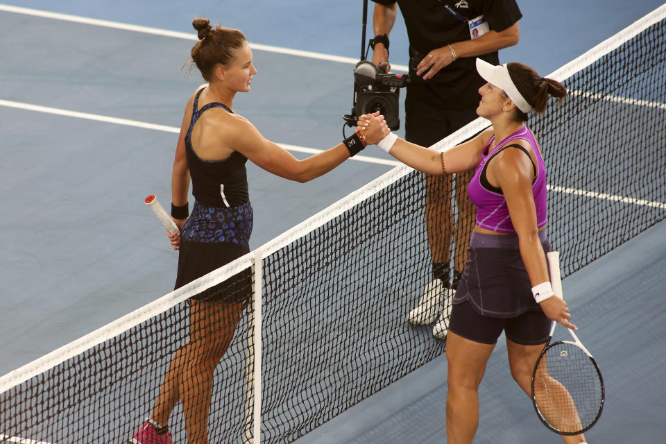 Russia's Veronika Kudermetova, left, is congratulated at the net after defeating Canada's Bianca Andreescu during their Round of 16 match at the Adelaide International Tennis tournament in Adelaide, Australia, Wednesday, Jan. 4, 2023. (AP Photo/Kelly Barnes)