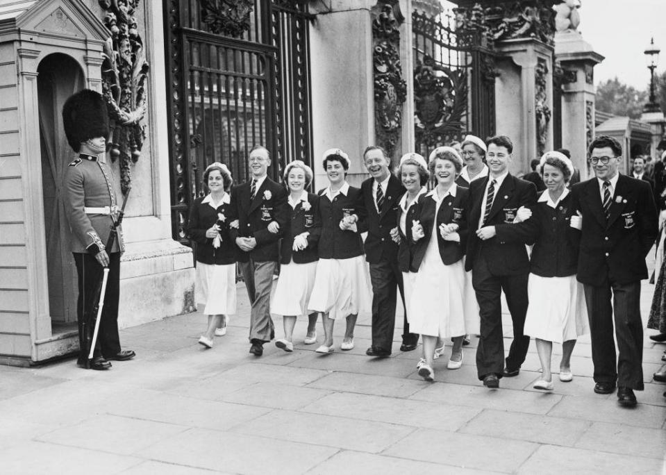 Members of the British Olympic team leave Buckingham Palace in London after receiving the good luck wishes of Queen Elizabeth II for the Summer Olympic Games in Helsinki, Finland, 10th July 1952.