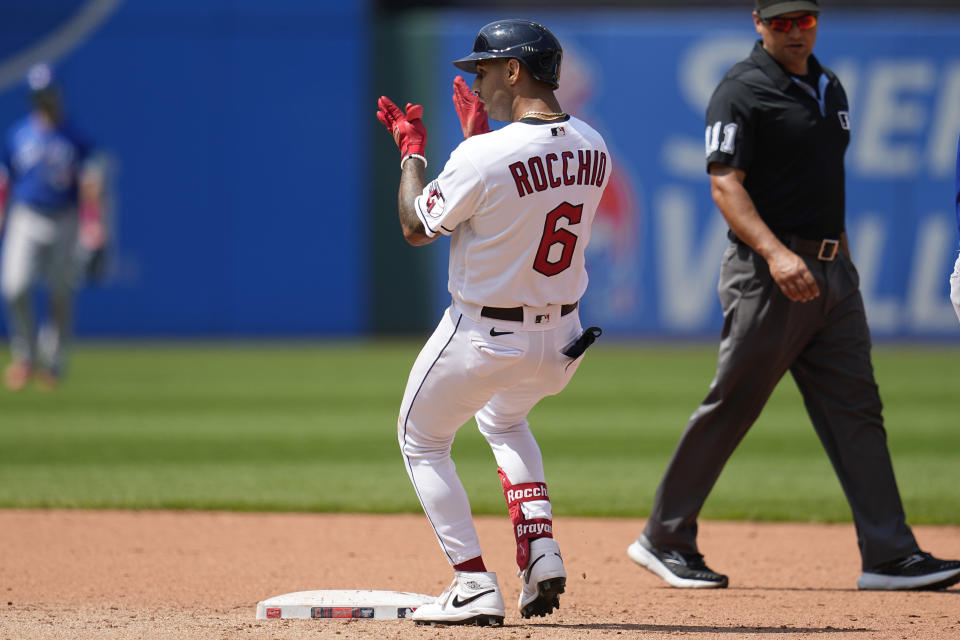 Cleveland Guardians' Brayan Rocchio (6) claps at second base after hitting a double in the fifth inning of a baseball game against the Toronto Blue Jays, Thursday, Aug. 10, 2023, in Cleveland. (AP Photo/Sue Ogrocki)