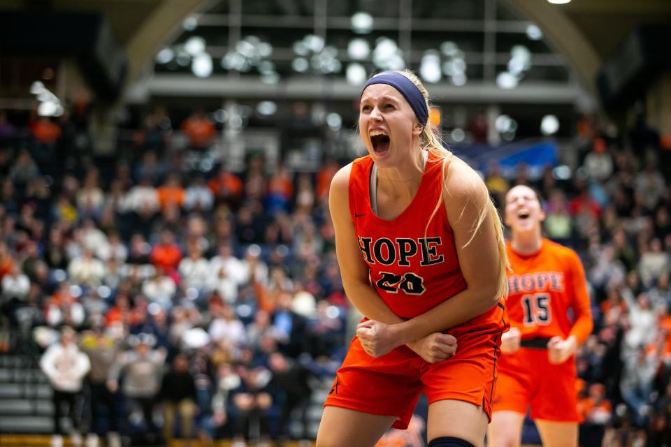 Hope's Kenedy Schoonveld celebrates as Hope advances to the Final Four with a win over NYU Saturday, March 12, 2022, at DeVos Fieldhouse. 