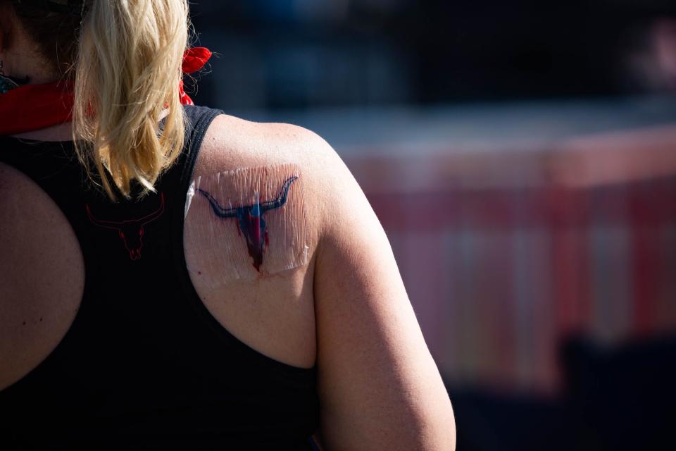 A healing tattoo on the second day of Country Thunder in Florence on April 12, 2024.