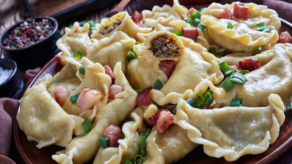 Nearly any filling will be delicious when making pierogies. Here are some with ground meat and liver filling, sprinkled with spring onion, bacon and sour cream. - from_my_point_of_view/iStockphoto/Getty Images