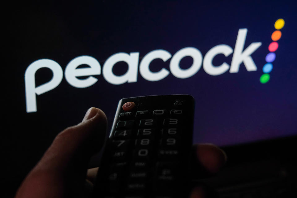 TV remote control is seen with Peacock logo displayed on a screen in this illustration photo taken in Krakow, Poland on February 6, 2022. (Photo by Jakub Porzycki/NurPhoto via Getty Images)