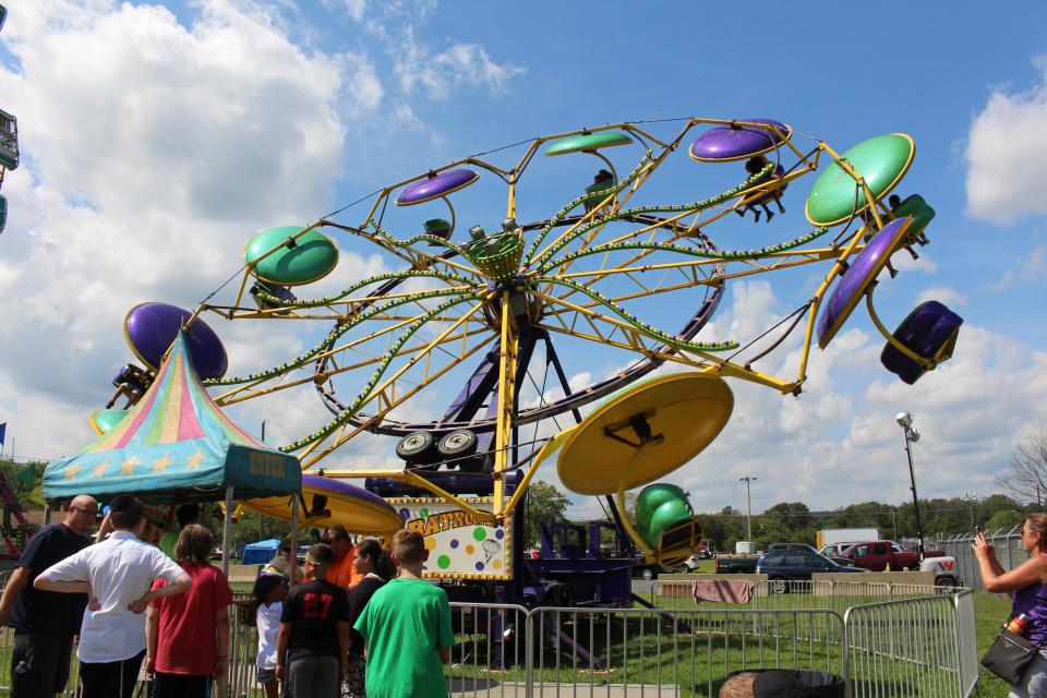 The annual West End Fair draws thousands of families and individuals to Monroe County for rides, games, food, displays and animal exhibits.