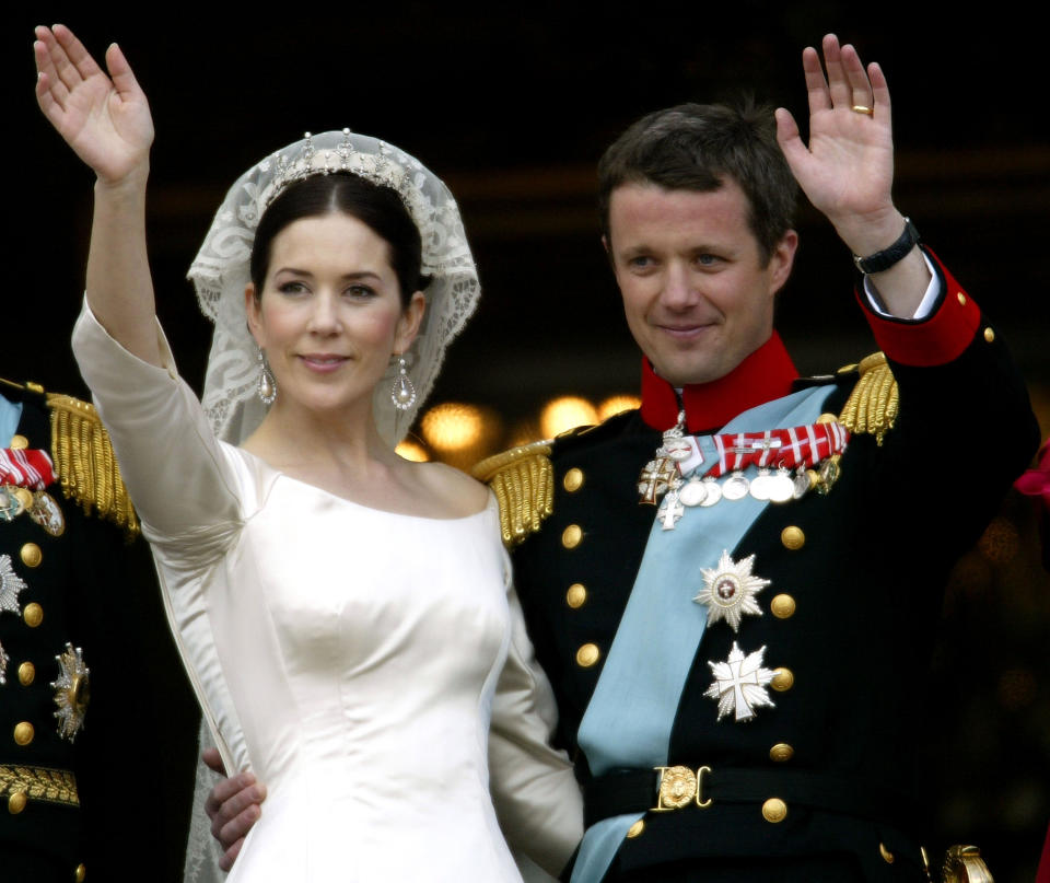 Crown Princess Mary and Crown Prince Frederik of Denmark wave from the balcony of Christian VII's Palace after their wedding May 14, 2004 in Copenhagen, Denmark. The romance began in 2000 when Mary Donaldson met the heir to one of Europe's oldest monarchies over drinks at the Sydney Olympics, where he was with the Danish sailing team. 