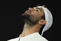 Matteo Berrettini of Italy reacts during his semifinal against Rafael Nadal of Spain at the Australian Open tennis championships in Melbourne, Australia, Friday, Jan. 28, 2022. (AP Photo/Andy Brownbill)