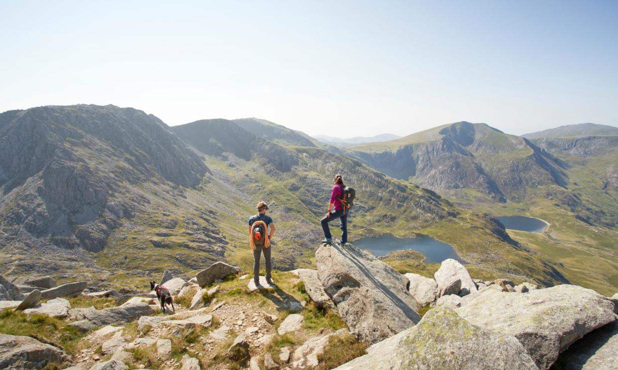 <span>Escape the crowds in Snowdonia, with mountains to climb and trails to hike.</span><span>Photograph: James O’Neil/Getty Images</span>