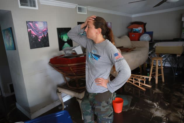 Stefanie Karas stands in her apartment after floodwater inundated it when Hurricane Ian passed through the area on Thursday in Fort Myers. (Photo: Joe Raedle via Getty Images)