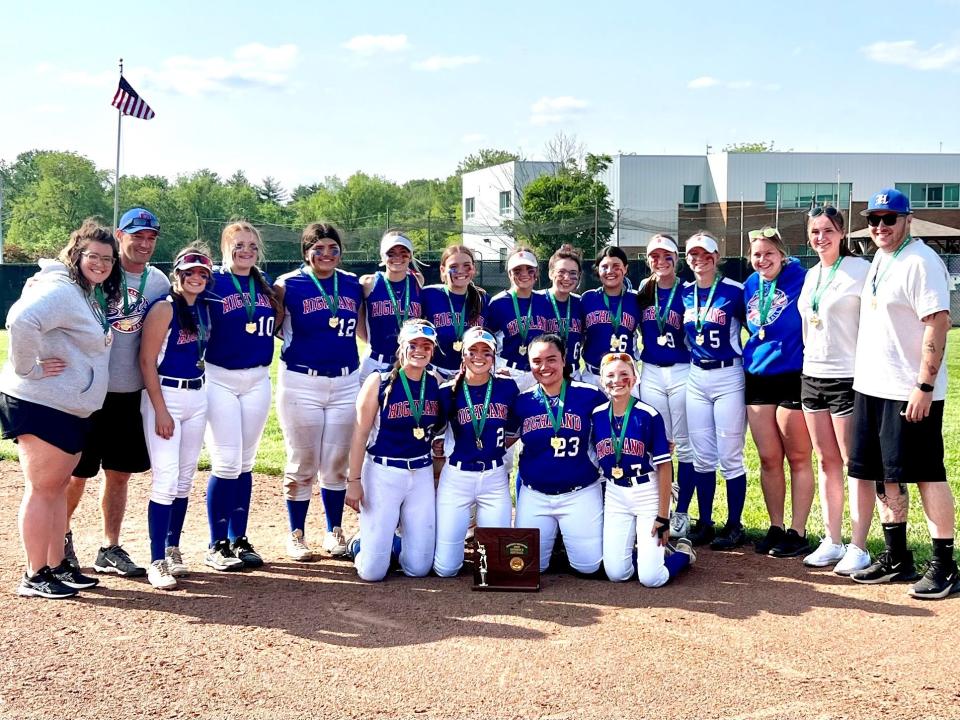 The Highland softball team poses with its 2023 Division II district championship trophy after beating Jonathan Alder 5-3 Saturday in Pickerington.