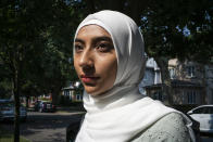 Ameena Ahmed poses for a photo, Tuesday, July 27, 2021, in the Brooklyn borough of New York. After her work as a substitute teacher in New York City dried up, Ameena Ahmed got a welcome $4,200 boost last summer in federal pandemic-related unemployment benefits.Then New York state started taking it back. (AP Photo/Eduardo Munoz Alvarez)