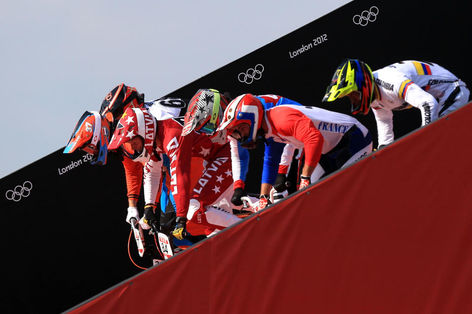 LONDON, ENGLAND - AUGUST 09: Riders start the race down the ramp during the Men's BMX Cycling Quarter Finals on Day 13 of the London 2012 Olympic Games at BMX Track on August 9, 2012 in London, England. (Photo by Phil Walter/Getty Images)