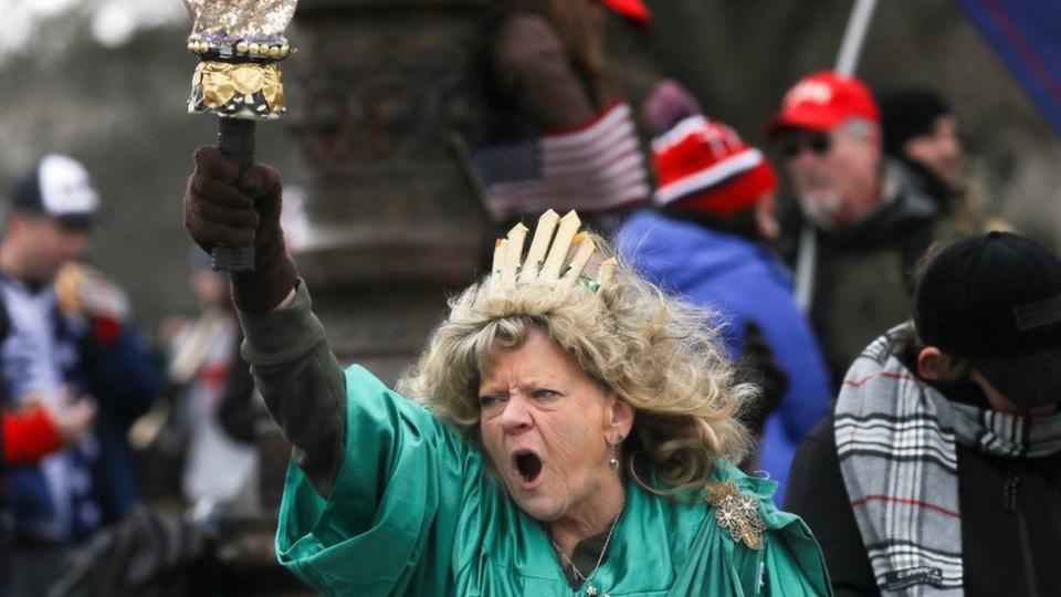 Leigh Ann Luck dressed up as the Statue of Liberty shouts as supporters of President Donald Trump gather near the Capitol building in Washington