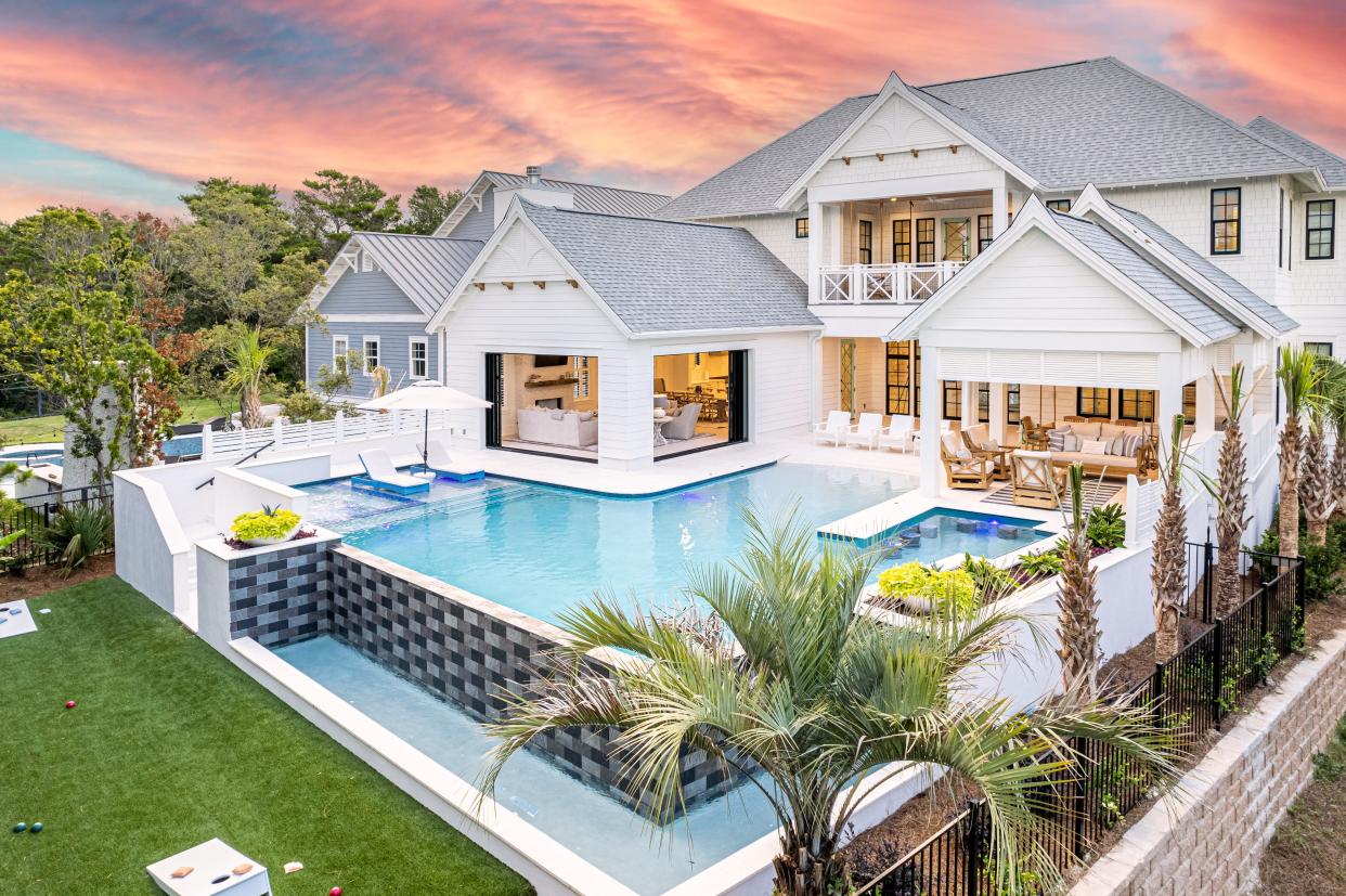 Paradise Found is located along Florida's scenic route 30A. Vrbo describes the beachside property as a "resort-like space thoughtfully designed to accommodate groups of all kinds and guests of all ages" with an "open concept living room that merges the indoors and outdoors."