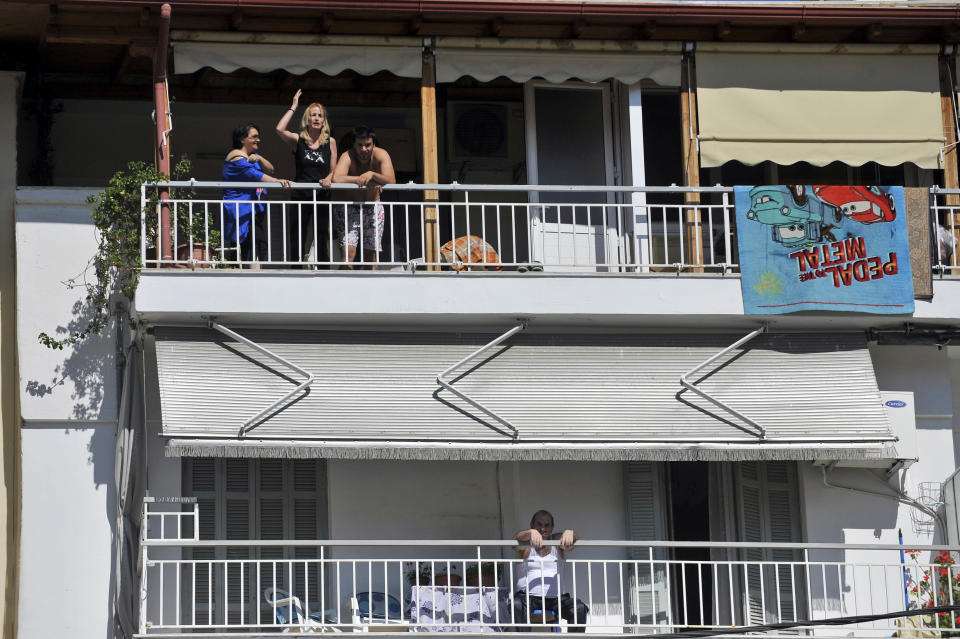 People in apartments adjacent to a voting station heckled Socialist leader Evangelos Venizelos, shouting slogans such as "Thieves Out!" in Thessaloniki, northern Greece May 6, 2012. Greeks cast ballots on Sunday in their most critical _ and uncertain _ election in decades, with voters set to punish the two main parties that are being held responsible for the country's dire economic straits. (AP Photo/Nikolas Giakoumidis)