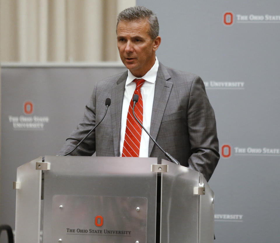 Ohio State football coach Urban Meyer makes a statement during a news conference in Columbus, Ohio, Wednesday, Aug. 22, 2018. Ohio State suspended Meyer on Wednesday for three games for mishandling domestic violence accusations, punishing one of the sport's most prominent leaders for keeping an assistant on staff for several years after the coach's wife accused him of abuse. Athletic director Gene Smith was suspended from Aug. 31 through Sept. 16. (AP Photo/Paul Vernon)