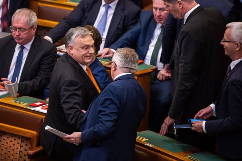 Hungarian Prime Minister Viktor Orban (L) takes part in the parliamentary session prior to the vote on the ratification of Sweden's NATO membership. Marton Monus/dpa