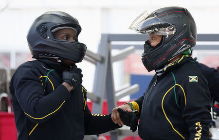 Bobsleigh - Pyeongchang 2018 Winter Olympics - Women's Training - Olympic Sliding Centre - Pyeongchang, South Korea - February 18, 2018 - Jazmine Fenlator-Victorian and Carrie Russell of Jamaica talk after finishing their run. REUTERS/Edgar Su