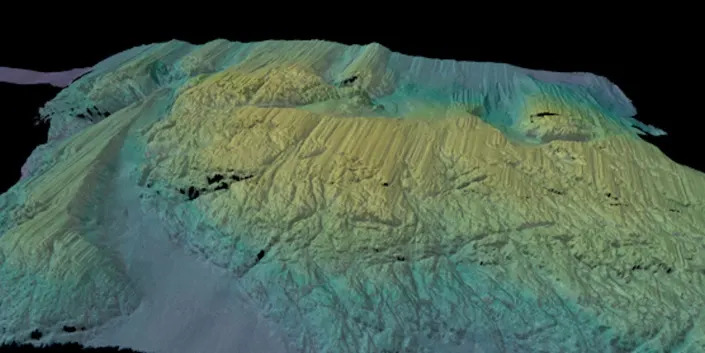 A 3D-rendered view of the multibeam bathymetry (seafloor shape) colored by depth, collected by Rán across a seabed ridge, just in front of Thwaites Ice Shelf.