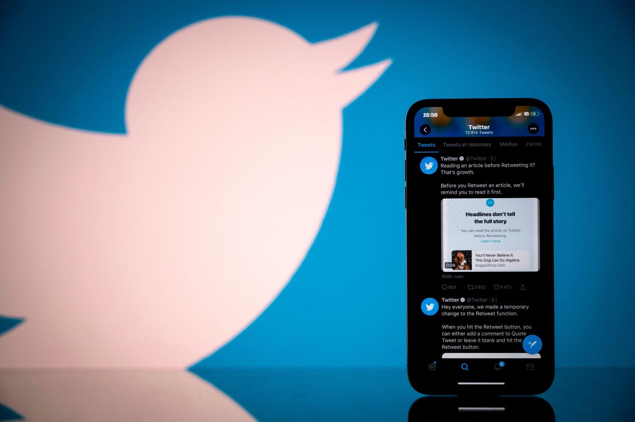 Photograph taken on 26 October, 2020, shows the logo of US social network Twitter displayed on the screen of a smartphone and a tablet in Toulouse, southern France (AFP via Getty Images)