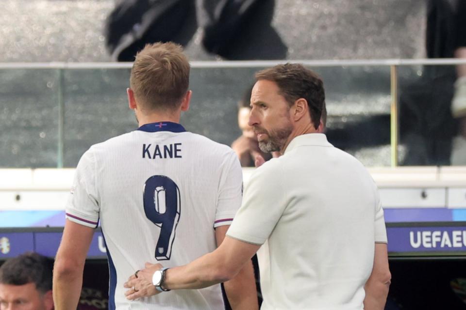 Gareth Southgate (right) talks to Harry Kane after removing the England captain (Getty Images)