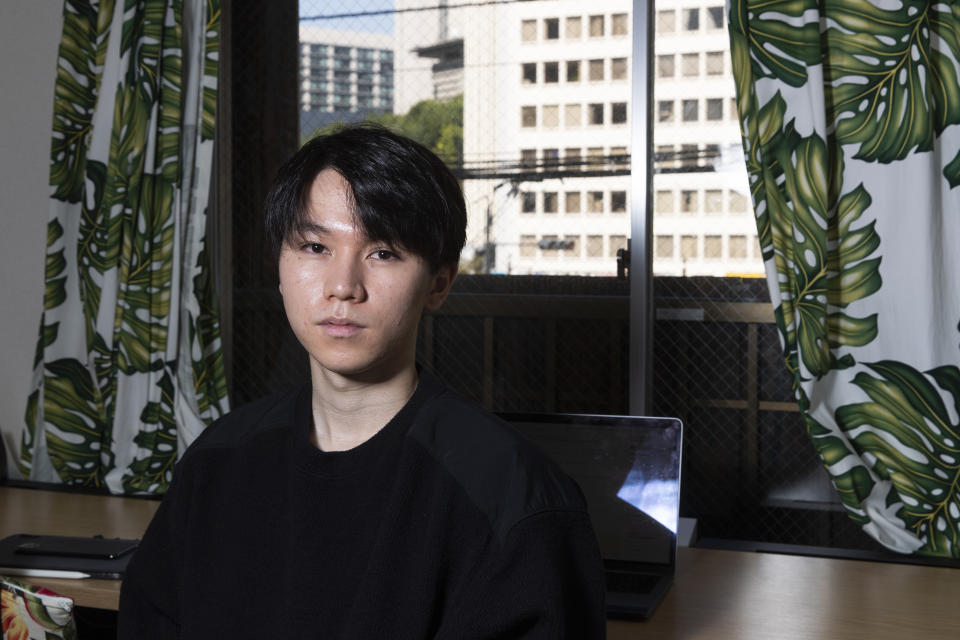 Koki Ozora, a college student who started a nonprofit called "Anata no Ibasho," or "A Place for You," poses for a photo in his office in Tokyo on Friday, Oct. 2, 2020. Suicides are on the rise among Japanese teens and that worries 21-year-old Ozora, who grew up depressed and lonely. His online Japanese-language chat service, run entirely by volunteers, offers a 24-hour text-messaging counseling for those seeking a sympathetic ear, promising to answer every request, within five seconds for urgent ones. (AP Photo/Hiro Komae)