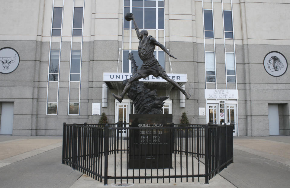 In this photo taken Feb. 28, 2012, a statue of former Chicago Bulls star Michael Jordan stands outside the United Center arena in Chicago. The "sneakerhead" craze started back in the late 1980s with the release of the first Nike Air Jordan shoe. People who track the shoe culture say the Internet and explosion of social networking has created new fervor for the hobby which resulted in riots in some cities during the release of some limited edition shoes in recent weeks. (AP Photo/Martha Irvine)