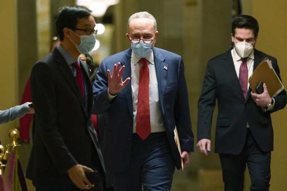 Senate Minority Leader Sen. Chuck Schumer of N.Y., walks on Capitol Hill in Washington, Tuesday, Dec. 15, 2020. (AP Photo/Susan Walsh)