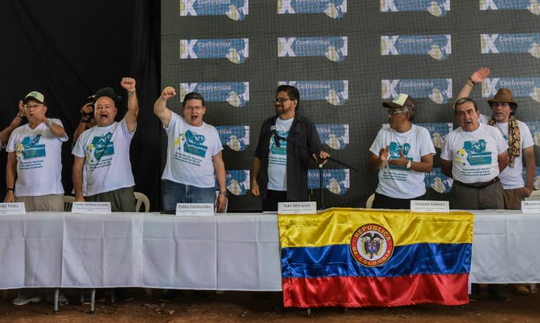 Members of the Revolutionary Armed Forces of Colombia (FARC) celebrate the approval of the peace deal with the government during the closing ceremony of the 10th National Guerrilla Conference in Llanos del Yari, Colombia, on September 23, 2016