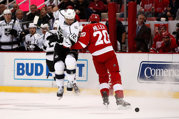 DETROIT, MI - DECEMBER 15: Marian Gaborik #12 of the Los Angeles Kings tries to jump around Drew Miller #20 of the Detroit Red Wings during the first period at Joe Louis Arena on December 15, 2016 in Detroit, Michigan. (Photo by Gregory Shamus/Getty Images)